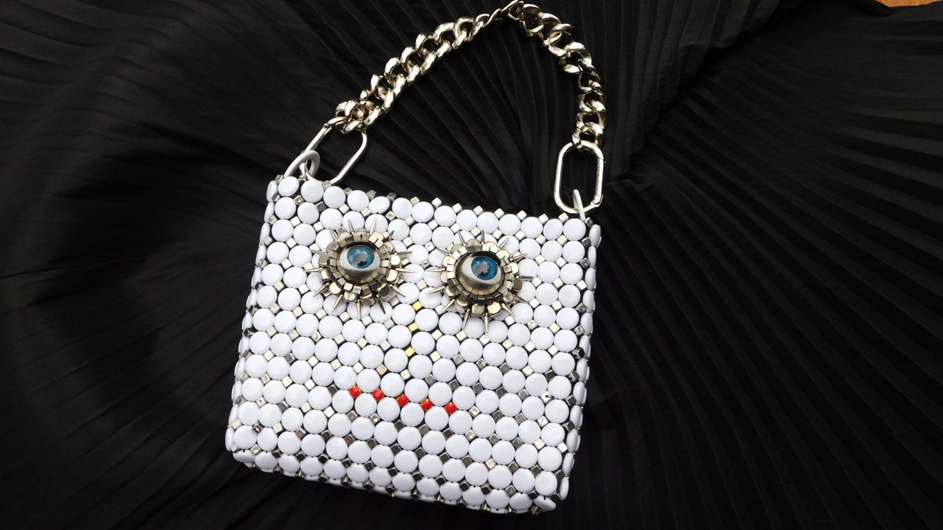 Solstice Surreal face Hand Bag