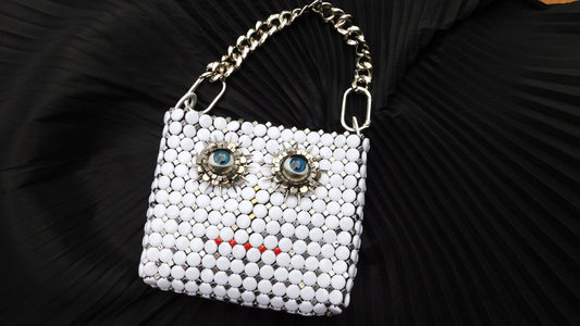 Solstice Surreal face Hand Bag