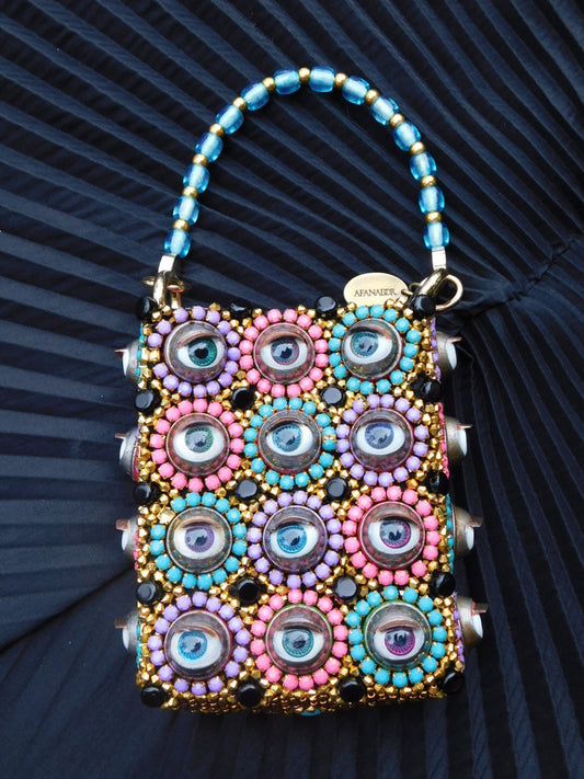 Solstice Hand Bag with doll eyes