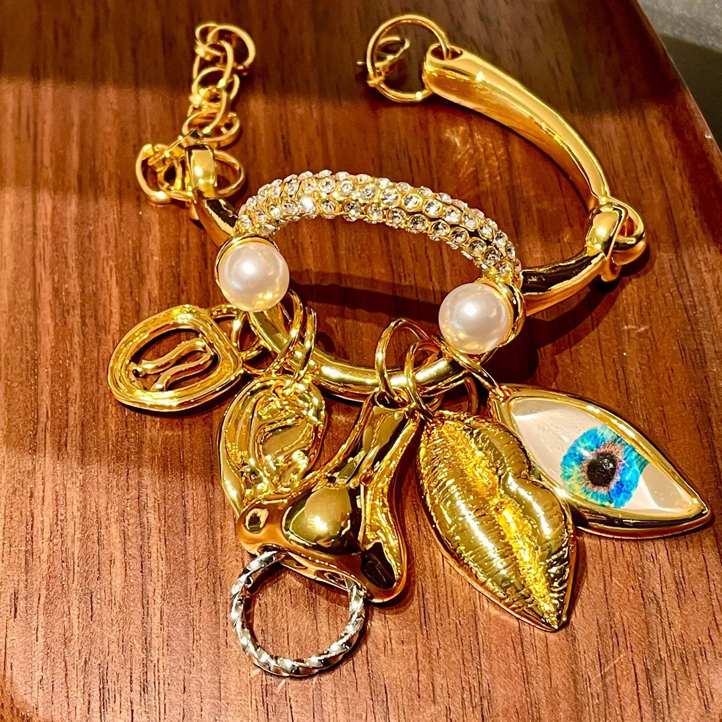 Metal facial features pendant bracelet with tassels