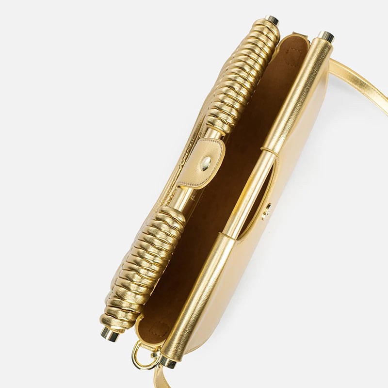 Gold pen with leather case on a white background
