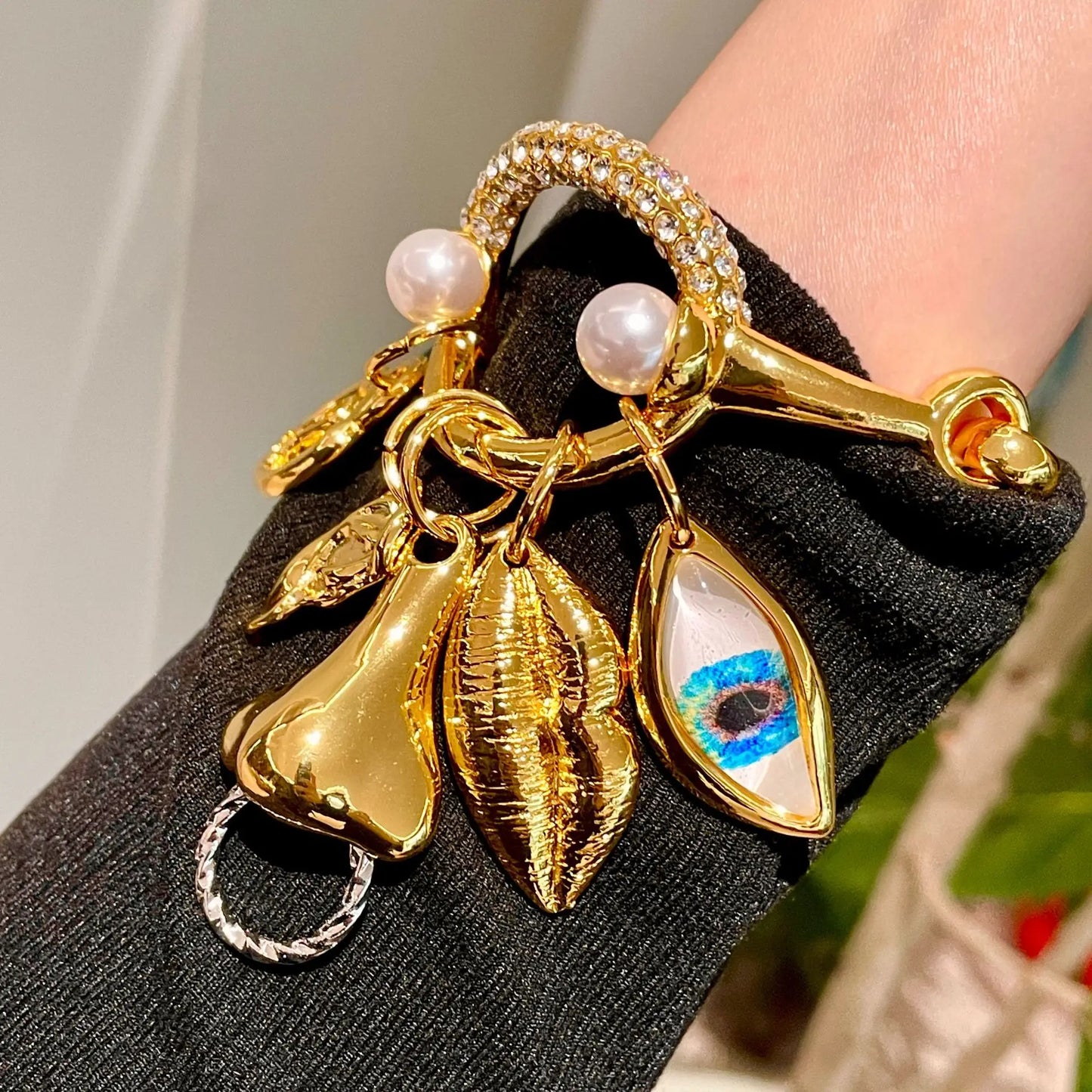 Metal facial features pendant bracelet with tassels