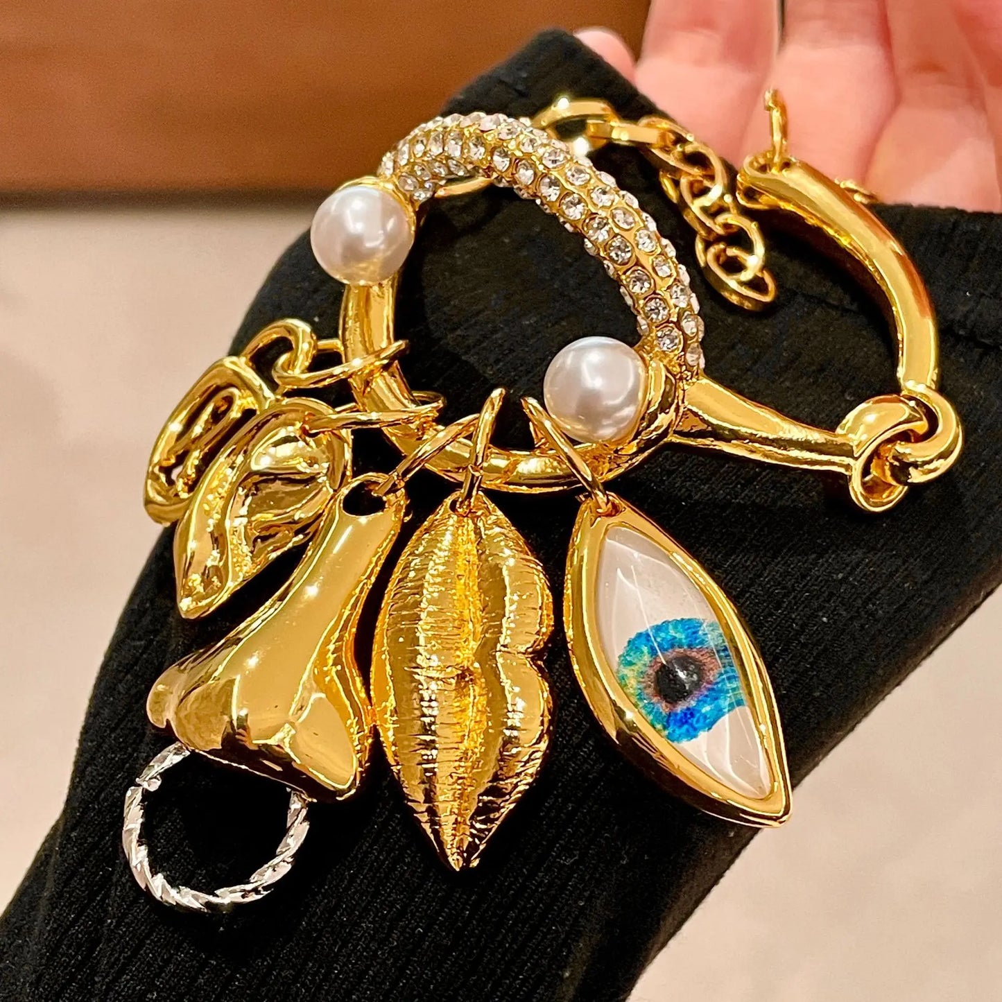 Metal facial features pendant bracelet with tassels