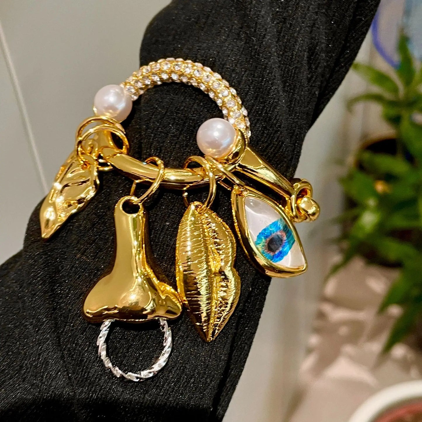 Metal facial features pendant bracelet with tassels