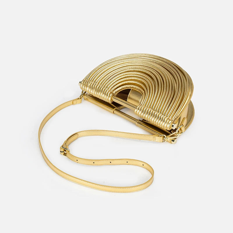 Gold handbag with a textured design on a white background