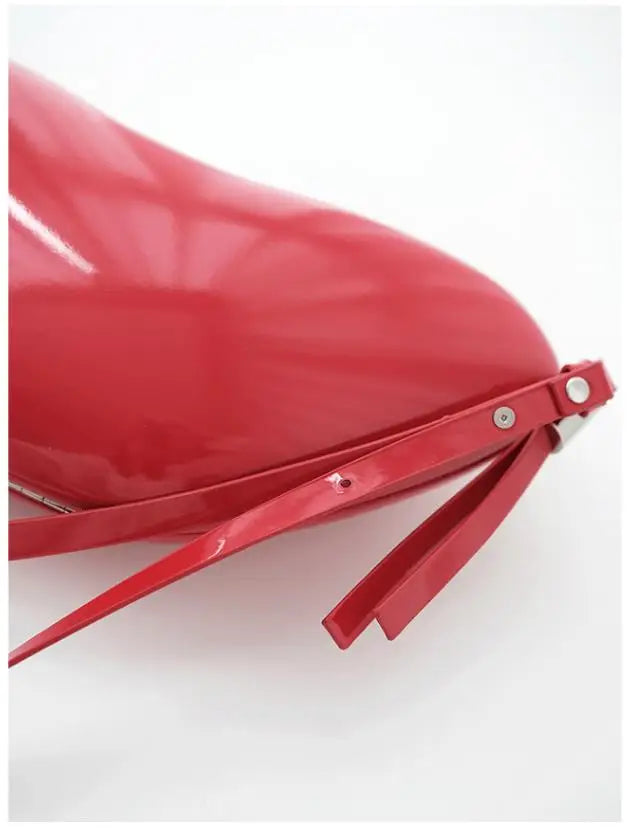 Close-up of a red car seat cover with a white background