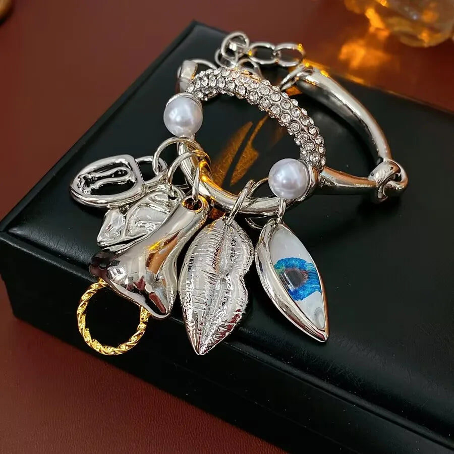 Metal facial features pendant bracelet with tassels